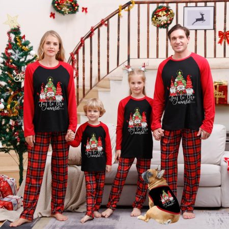 Family and pet are wearing black and red Gonk Christmas pyjamas