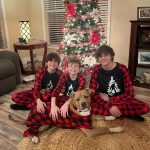 Kids And Dogs Wearing Matching Family Christmas Pyjamas